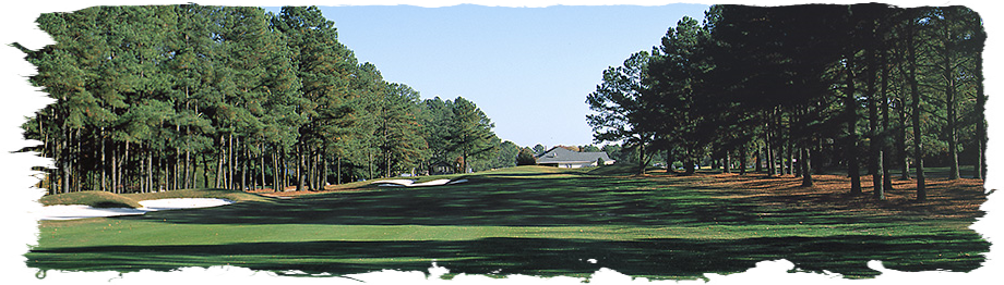 Image: Open fairway with sand traps on left and club house in background