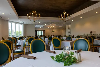 Image: Table settings in Salem Glen Country Club dining room.