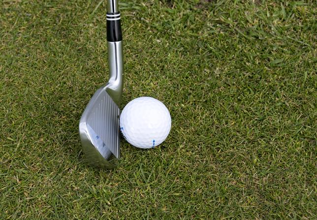 Image: Iron striking golf ball